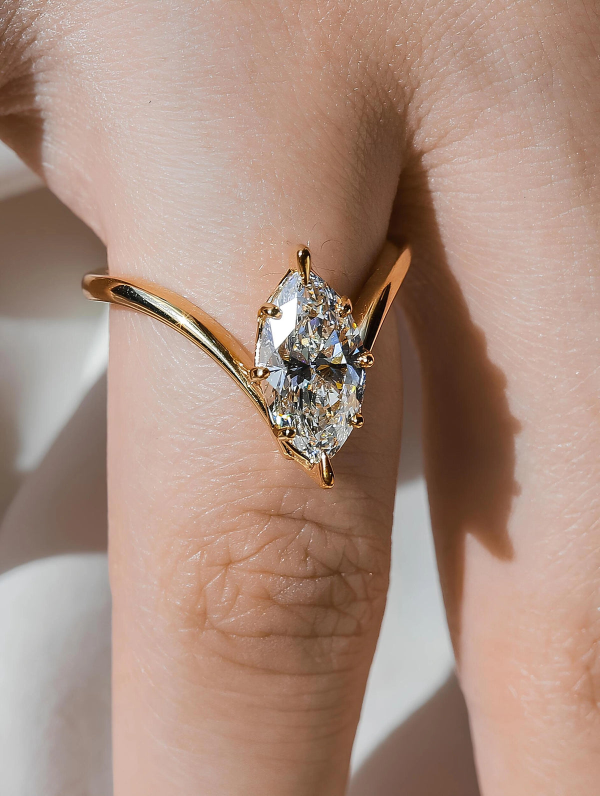 Common :: Sculptural Marquise solitaire engagement ring with polished curved shoulders