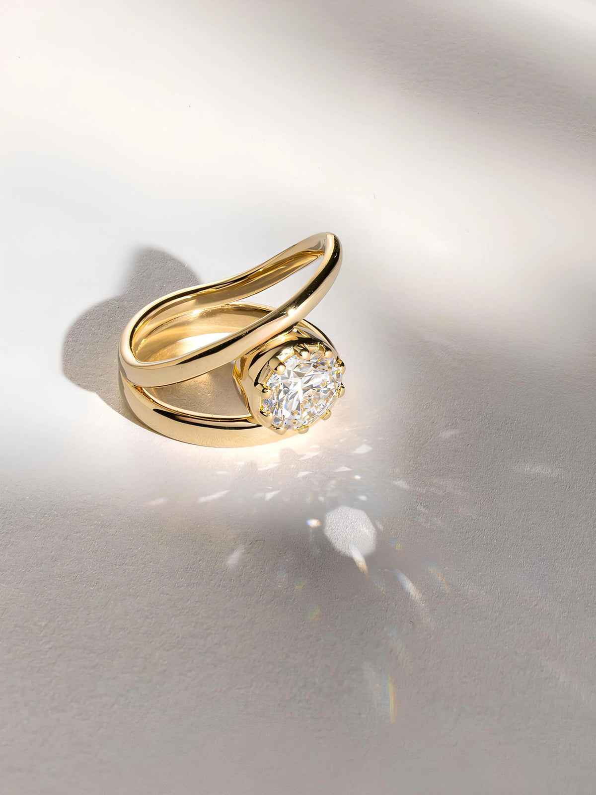 Common :: 1.80ct Round diamond ring with flowing upper and lower metal curves