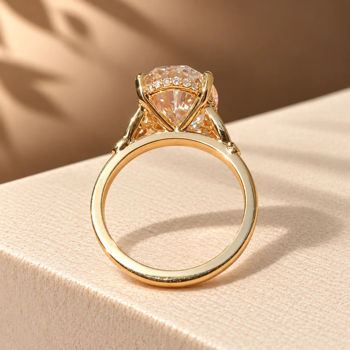 Common :: 5ct Oval center with 0.10TCW Round Hidden Halo accents