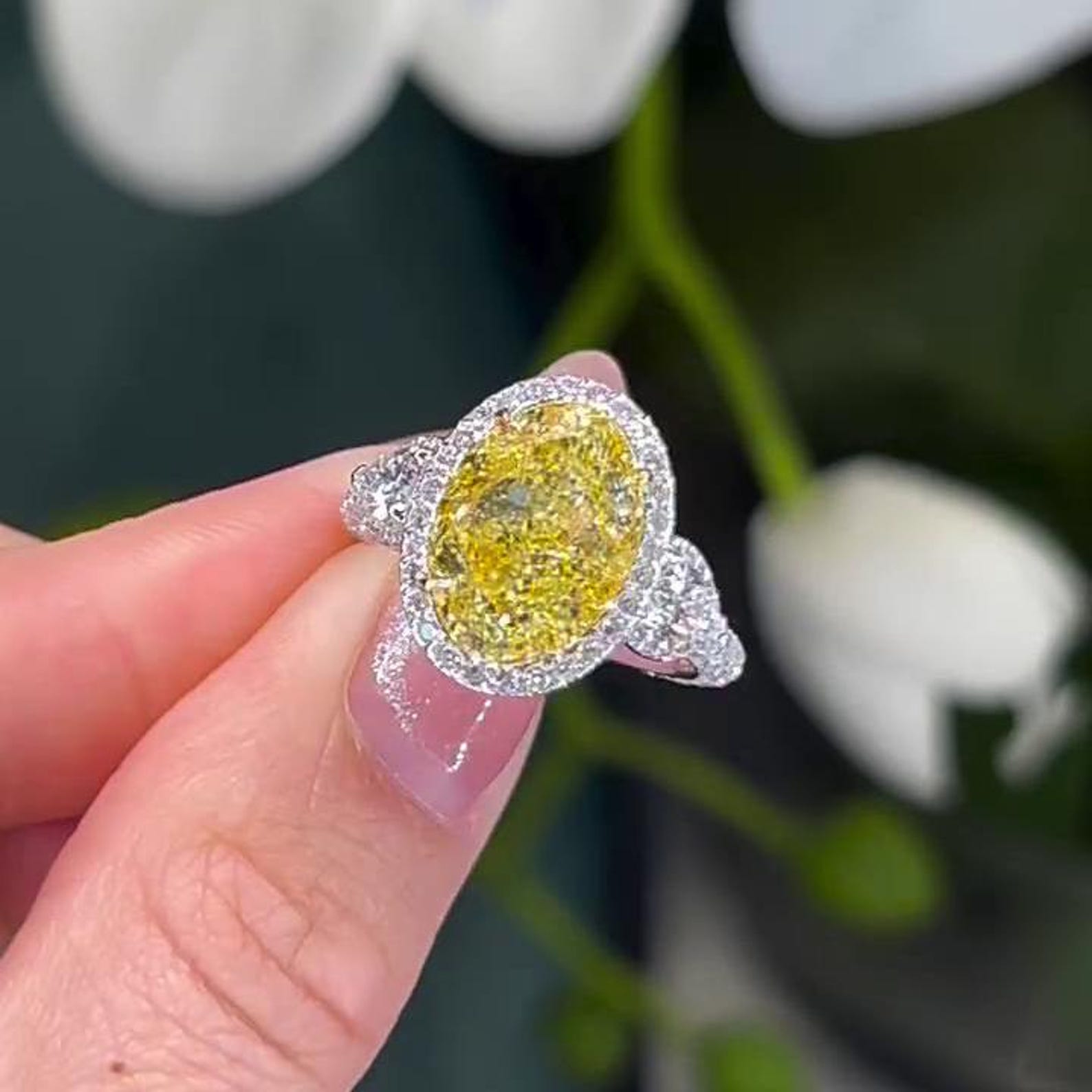 Oval Fancy Yellow 7.40tcw Lab Diamond Halo Three Stone Ring | IGI Certified VVS-VS Clarity