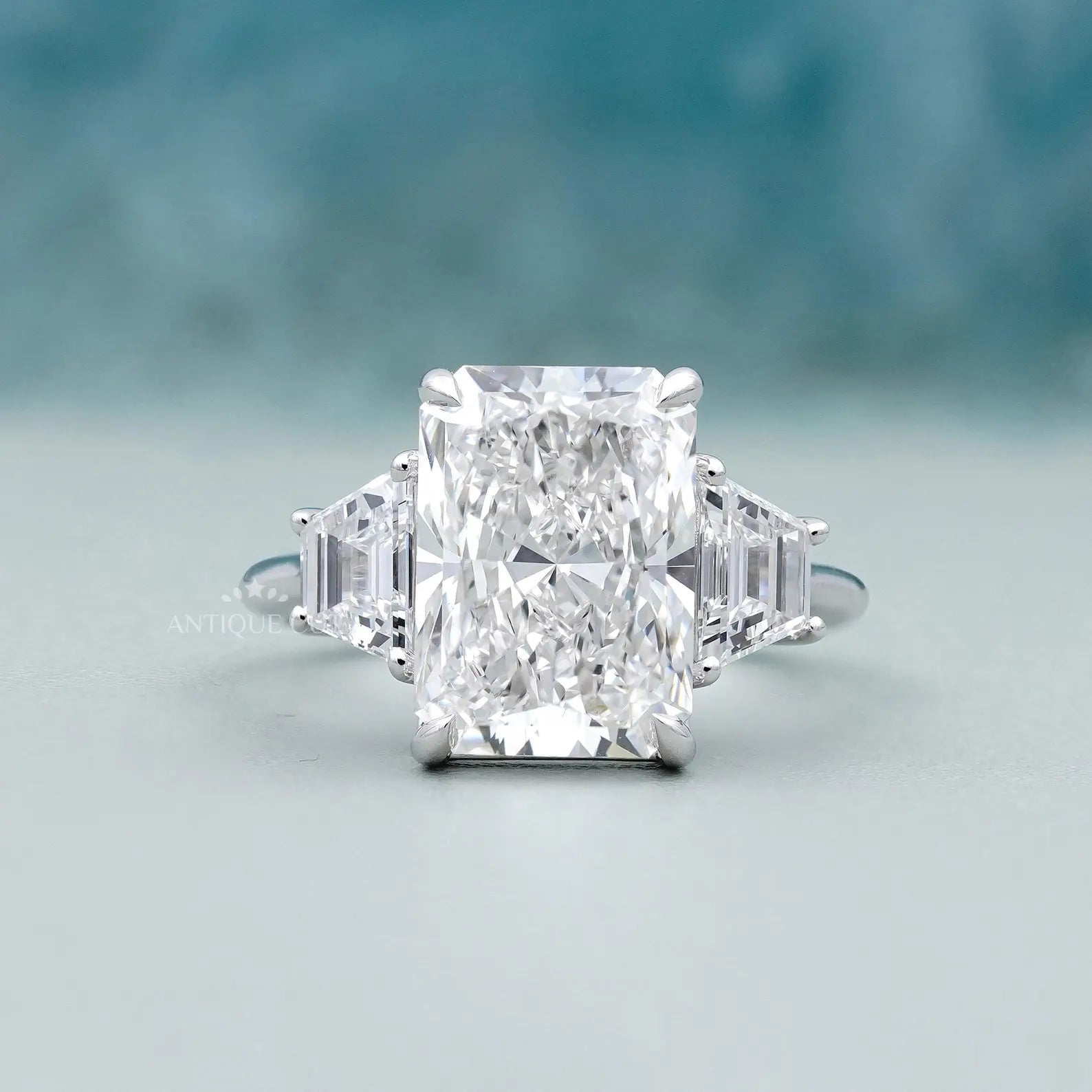 Radiant 5.97tcw Lab Grown Diamond Three-Stone Engagement Ring | Trapezoid Side Stones | D–F Color | VVS–VS Clarity