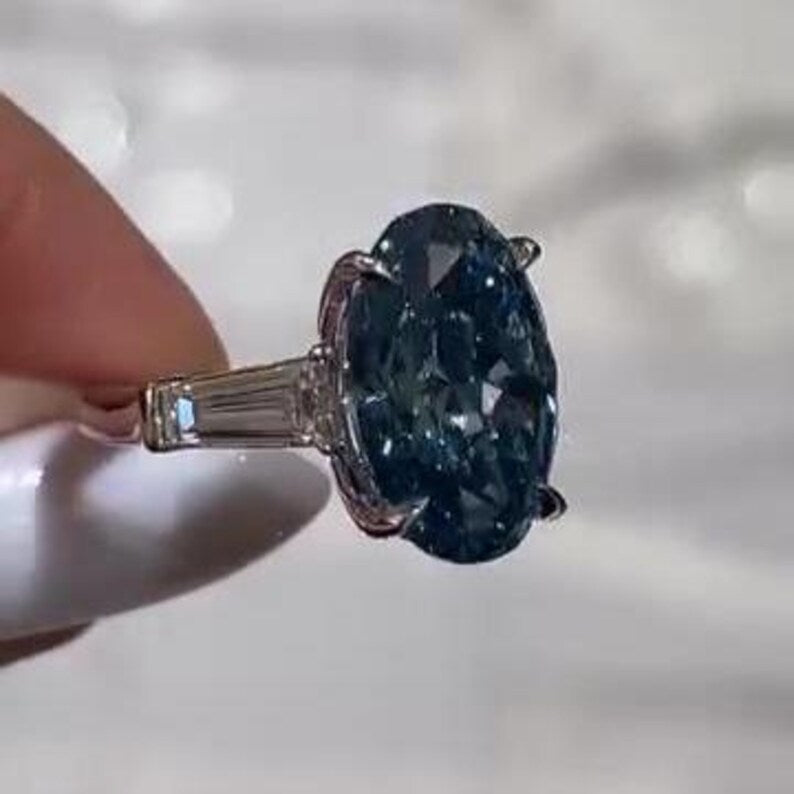 Oval Fancy Blue 8.50tcw Lab Diamond Ring | Three Stone Baguette Sides | Cathedral Shank | IGI Certified VVS–VS