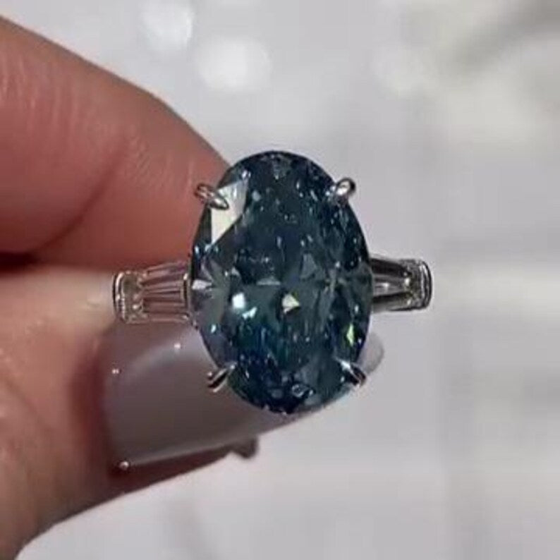 Oval Fancy Blue 8.50tcw Lab Diamond Ring | Three Stone Baguette Sides | Cathedral Shank | IGI Certified VVS–VS