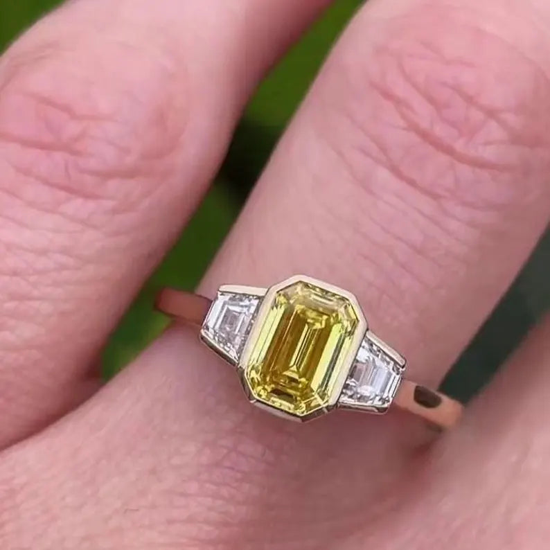 Fancy Yellow Emerald 1.50tcw Lab Grown Diamond Three Stone Ring | IGI Certified VVS–VS