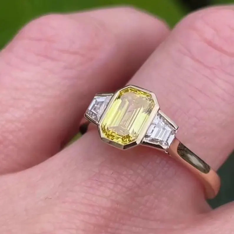 Fancy Yellow Emerald 1.50tcw Lab Grown Diamond Three Stone Ring | IGI Certified VVS–VS