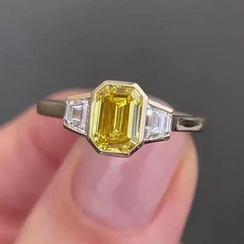 Fancy Yellow Emerald 1.50tcw Lab Grown Diamond Three Stone Ring | IGI Certified VVS–VS