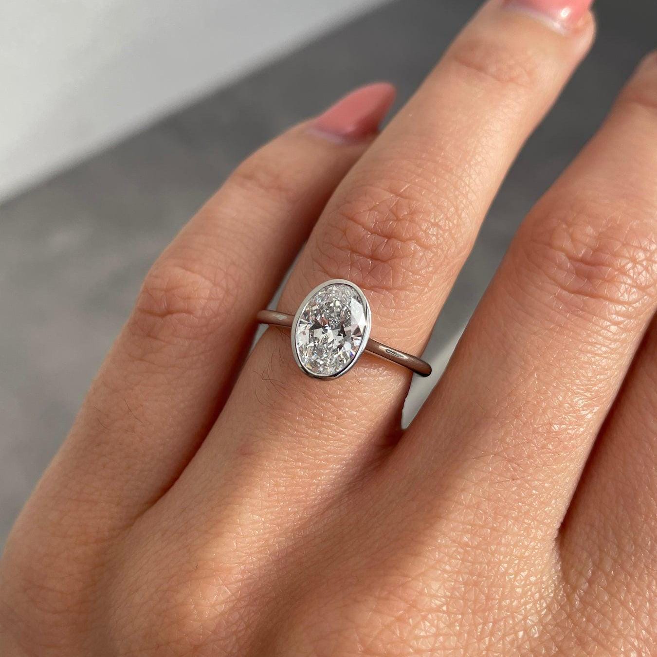 1.50 Carat Oval Lab-Grown Diamond Engagement Ring | Bezel Set | IGI Certified | DEF Color