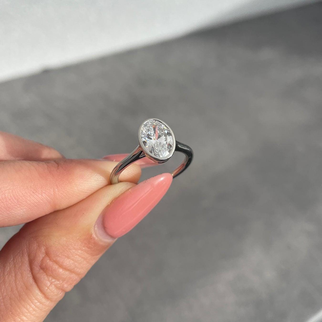 1.50 Carat Oval Lab-Grown Diamond Engagement Ring | Bezel Set | IGI Certified | DEF Color