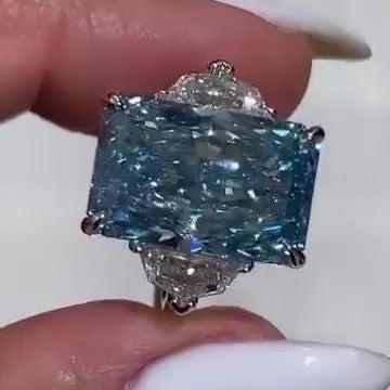 Radiant 8.00tcw Fancy Blue Lab Grown Diamond Ring | Three Stone Design with 1.00ct Cadillac Side Stones | IGI Certified | VVS-VS Clarity