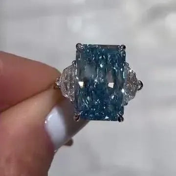 Radiant 8.00tcw Fancy Blue Lab Grown Diamond Ring | Three Stone Design with 1.00ct Cadillac Side Stones | IGI Certified | VVS-VS Clarity