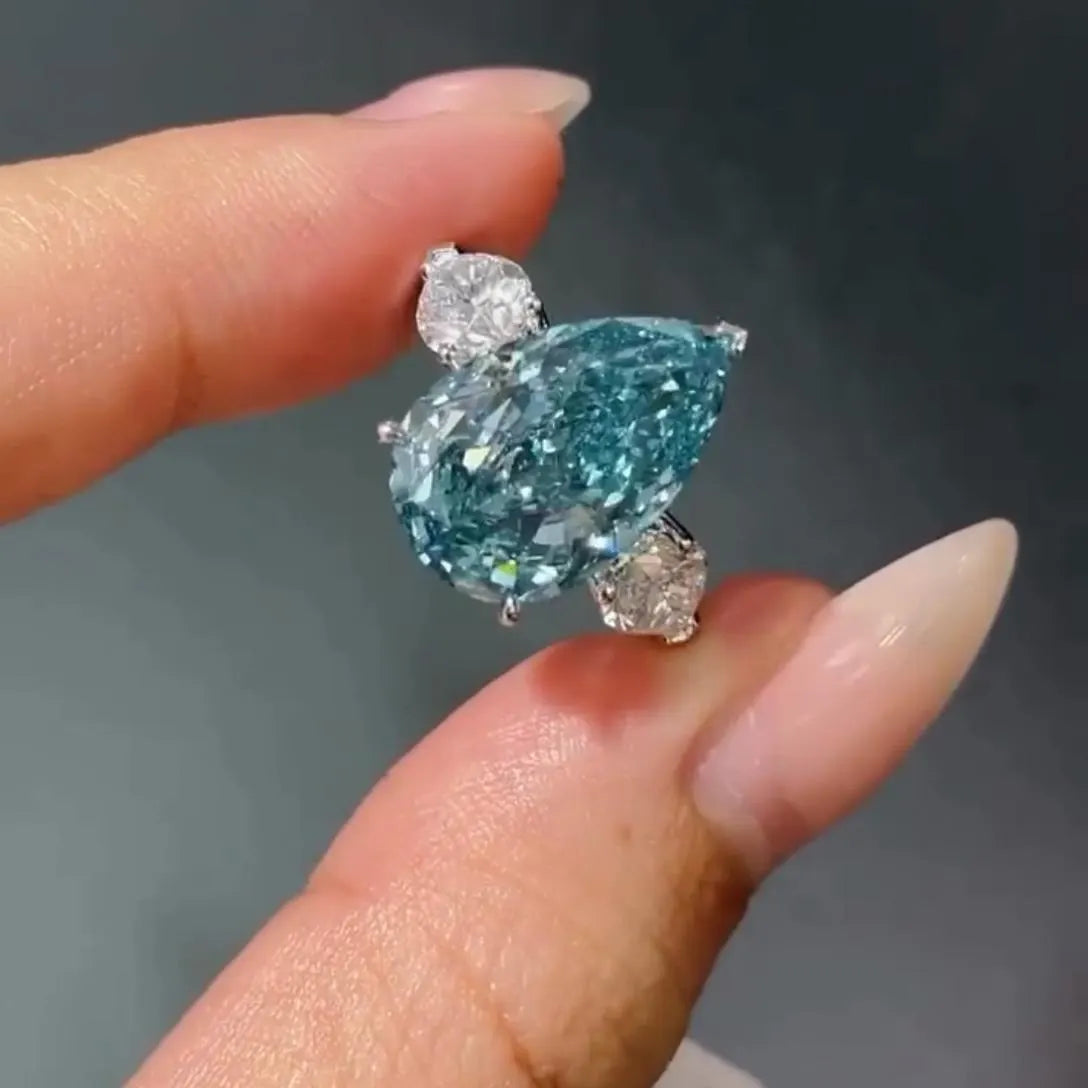 Fancy Blue Pear 7.00tcw Lab Diamond Ring | Three Stone  | 6ct Center + 1ct Side Stones