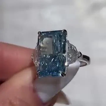 Radiant 8.00tcw Fancy Blue Lab Grown Diamond Ring | Three Stone Design with 1.00ct Cadillac Side Stones | IGI Certified | VVS-VS Clarity
