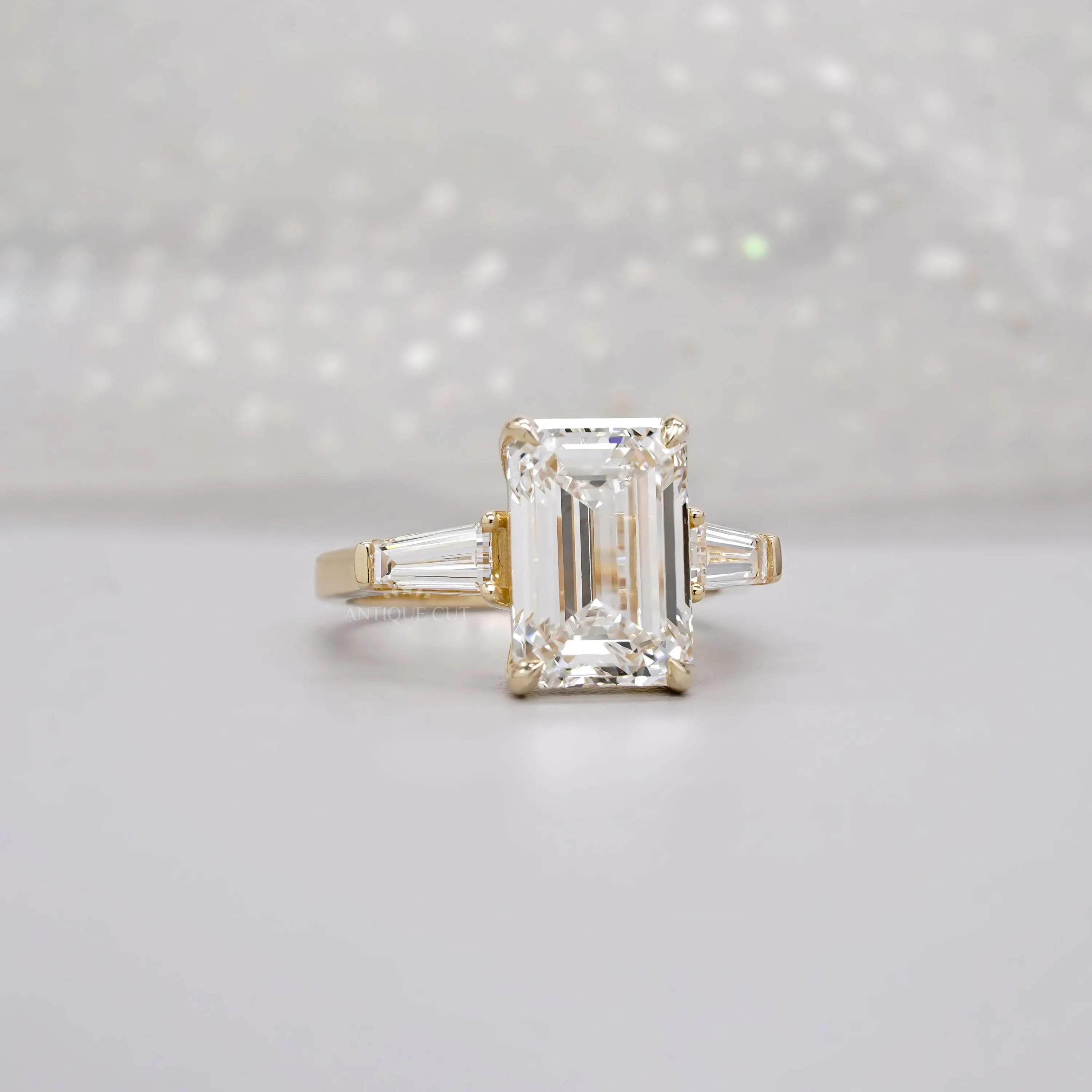 Emerald 5.60tcw Lab Diamond Three Stone Engagement Ring | Tap Baguette Side | IGI Certified