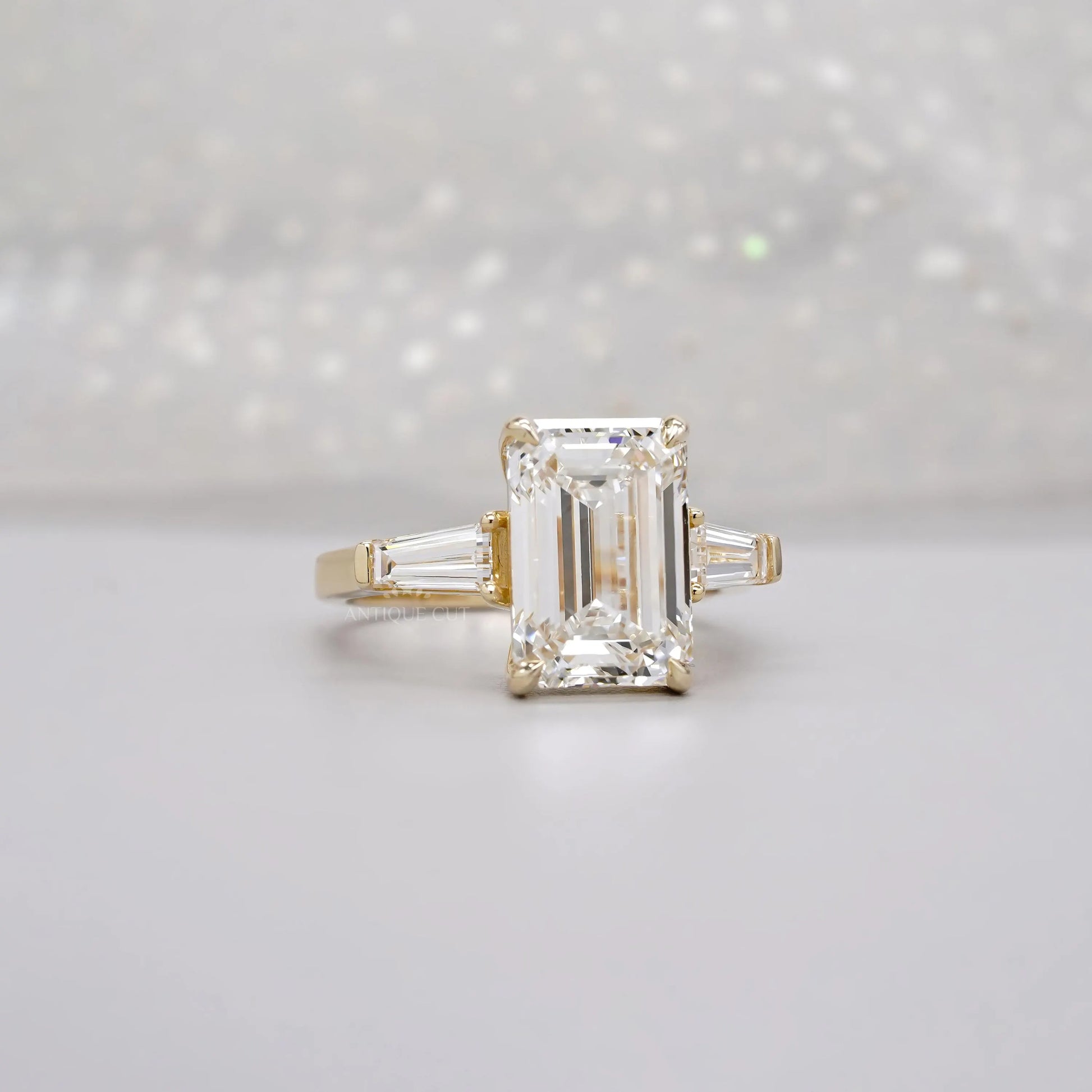 Emerald 5.60tcw Lab Diamond Three Stone Engagement Ring | Tap Baguette Side | IGI Certified