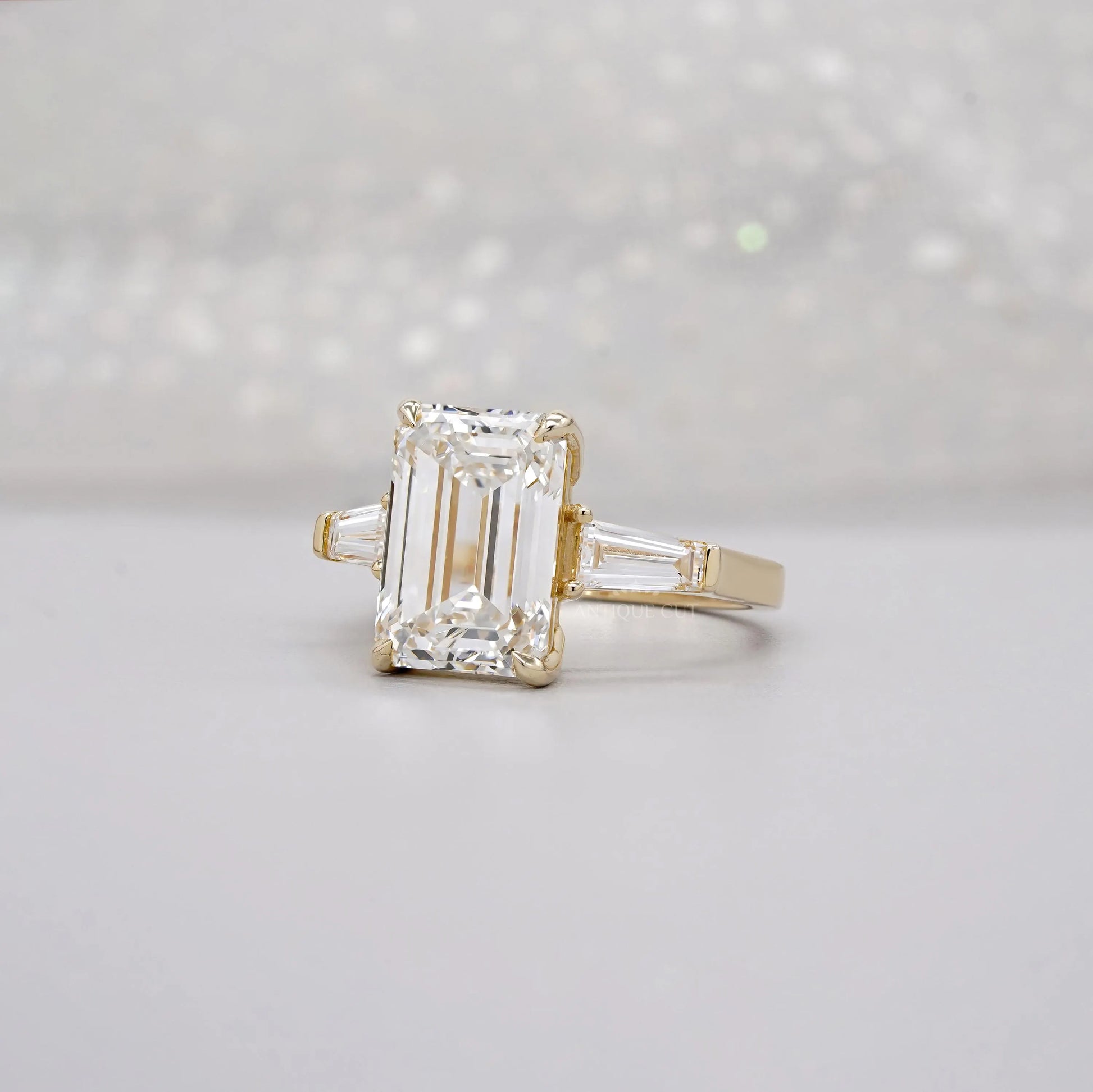 Emerald 5.60tcw Lab Diamond Three Stone Engagement Ring | Tap Baguette Side | IGI Certified