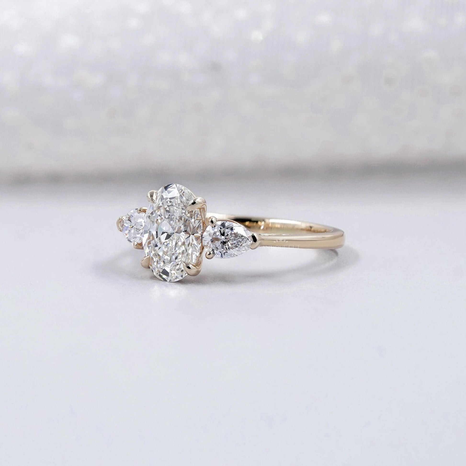 Oval Cut 2.00tcw Lab Grown Diamond Engagement Ring | Three Stone Pear Side Design | IGI Certified