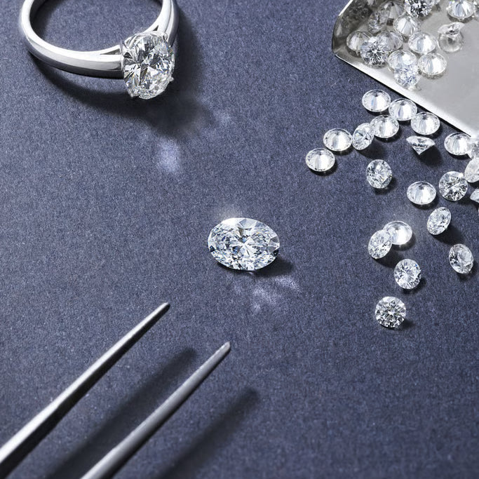 lab grown diamond jewelry with loose diamonds and ring showcasing IGI certified sustainable craftsmanship