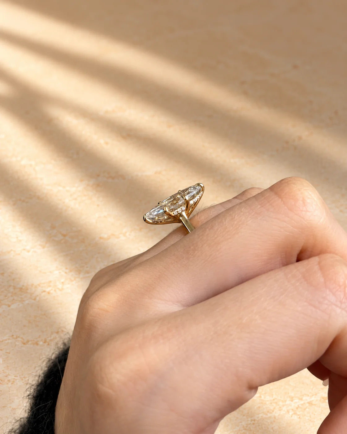 Common :: Marquise hidden halo engagement ring with a delicate 2MM band.