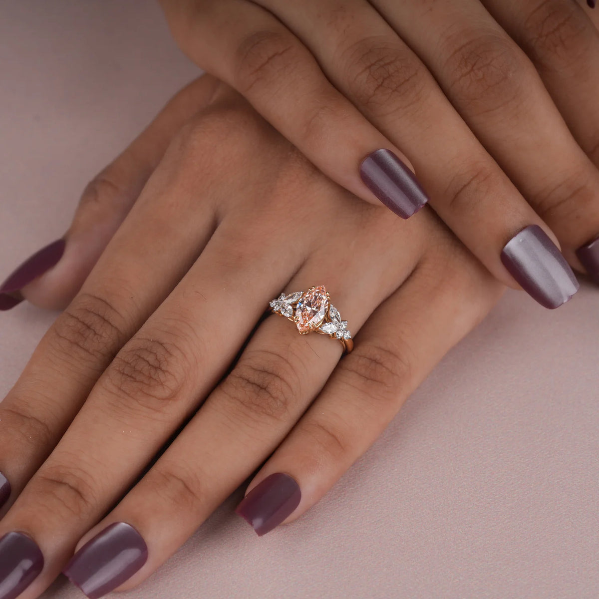 Common :: Close-up of a 1.30TCW pink marquise lab grown diamond engagement ring.