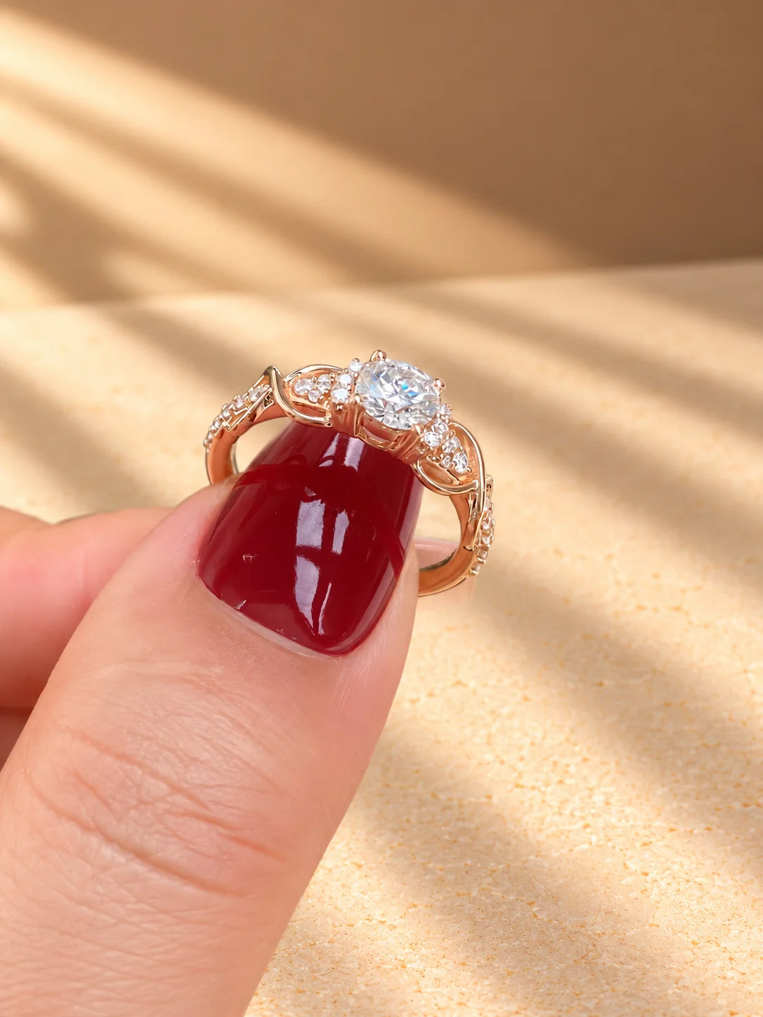 Common :: Close-up of a round lab grown diamond engagement ring with nature-inspired styling.