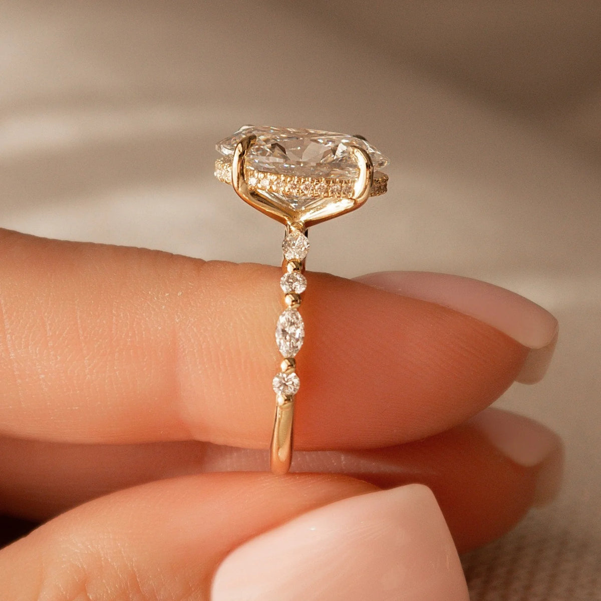 Common :: Luxury oval hidden halo engagement ring featuring a slim 2MM band.
