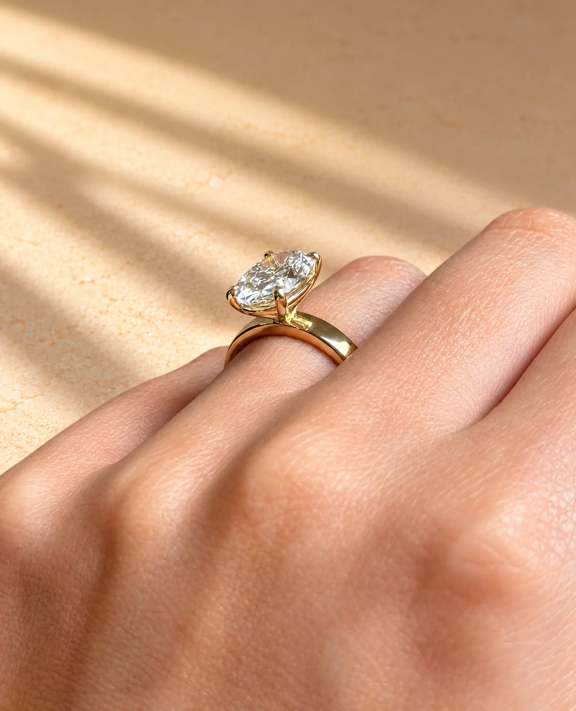 Common :: 3CT oval solitaire engagement ring with a distinctive 3MM band.
