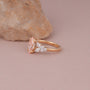 Common :: Unique pink diamond engagement ring with an elongated marquise center stone.