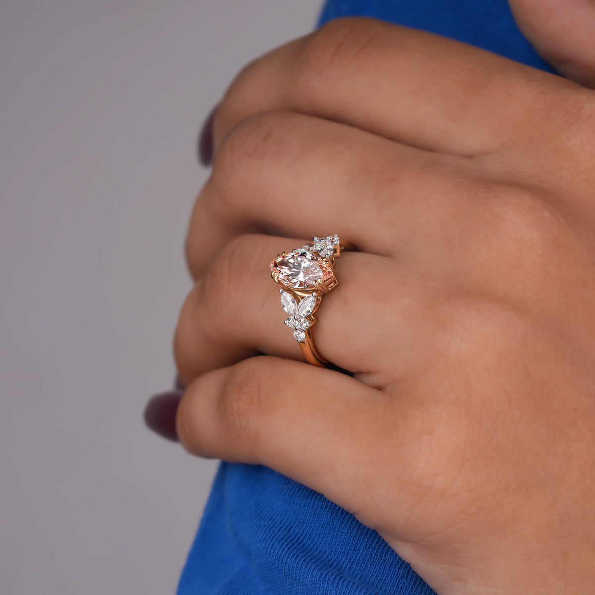 Common :: Nature-inspired pink marquise engagement ring featuring a delicate 2MM band.