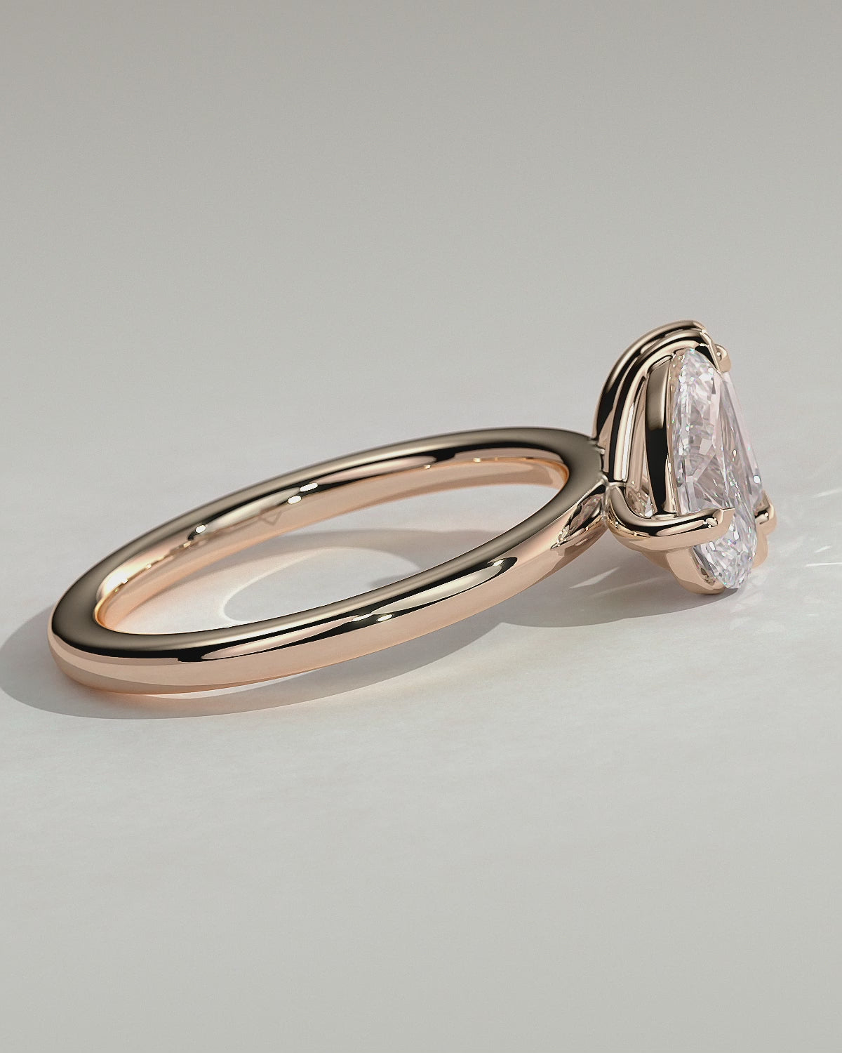 Rose :: Elvoria pear and emerald toi et moi lab grown diamond engagement ring 360 view rose gold IGI certified two stone ring