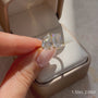 Common :: Luxury two stone ring with a 2 carat emerald cut and 1.50 carat pear cut lab diamond.