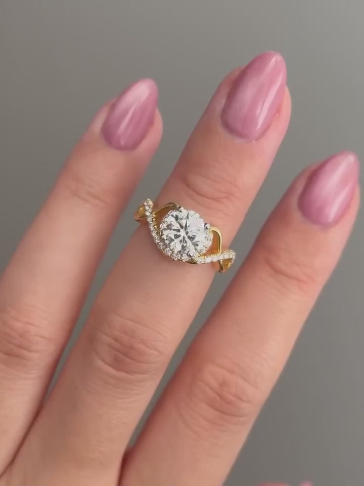 Common :: 1.80ct Round diamond with flowing pavé shoulders showcase