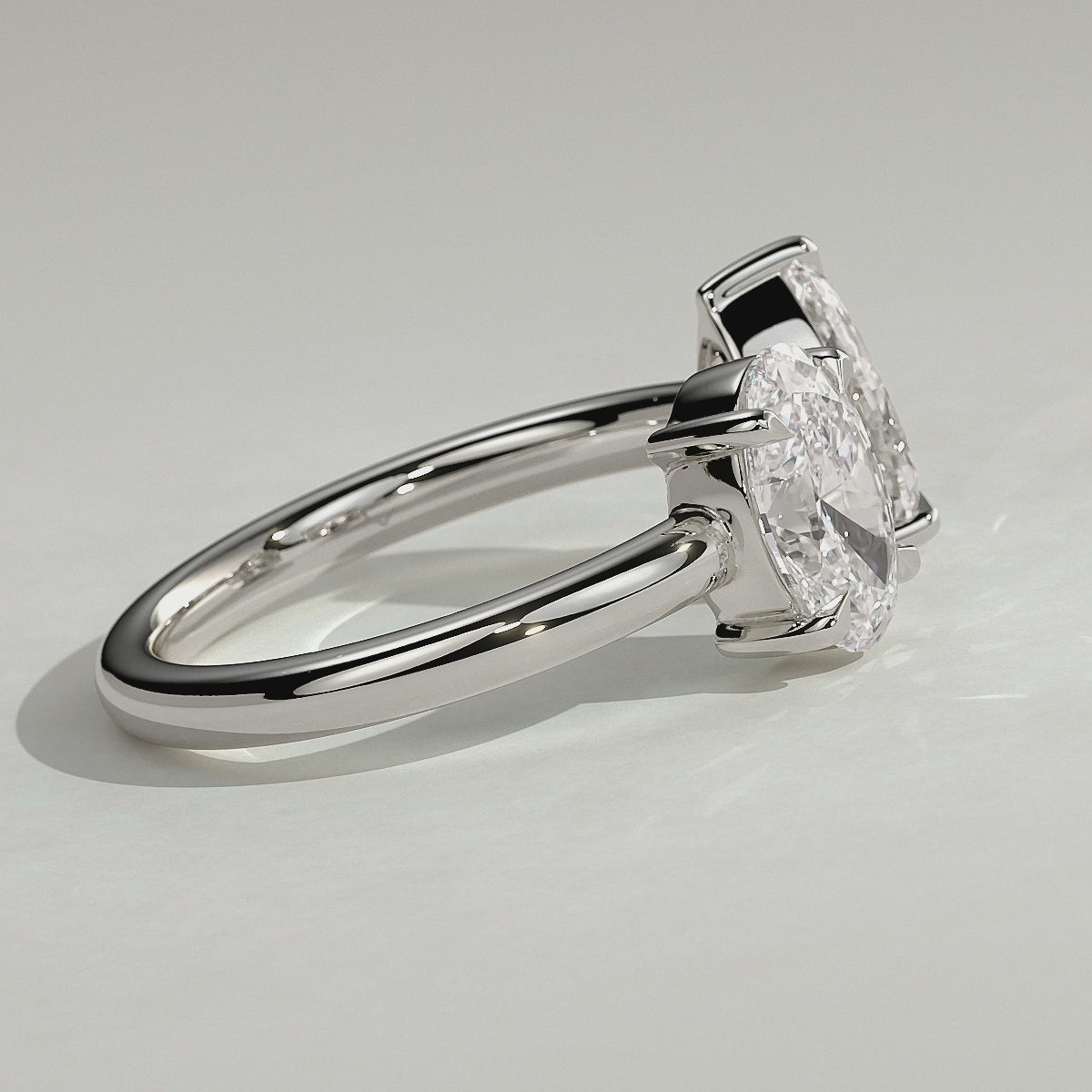White :: Noriquea oval and pear toi et moi lab grown diamond engagement ring 360 view white gold IGI certified two stone ring