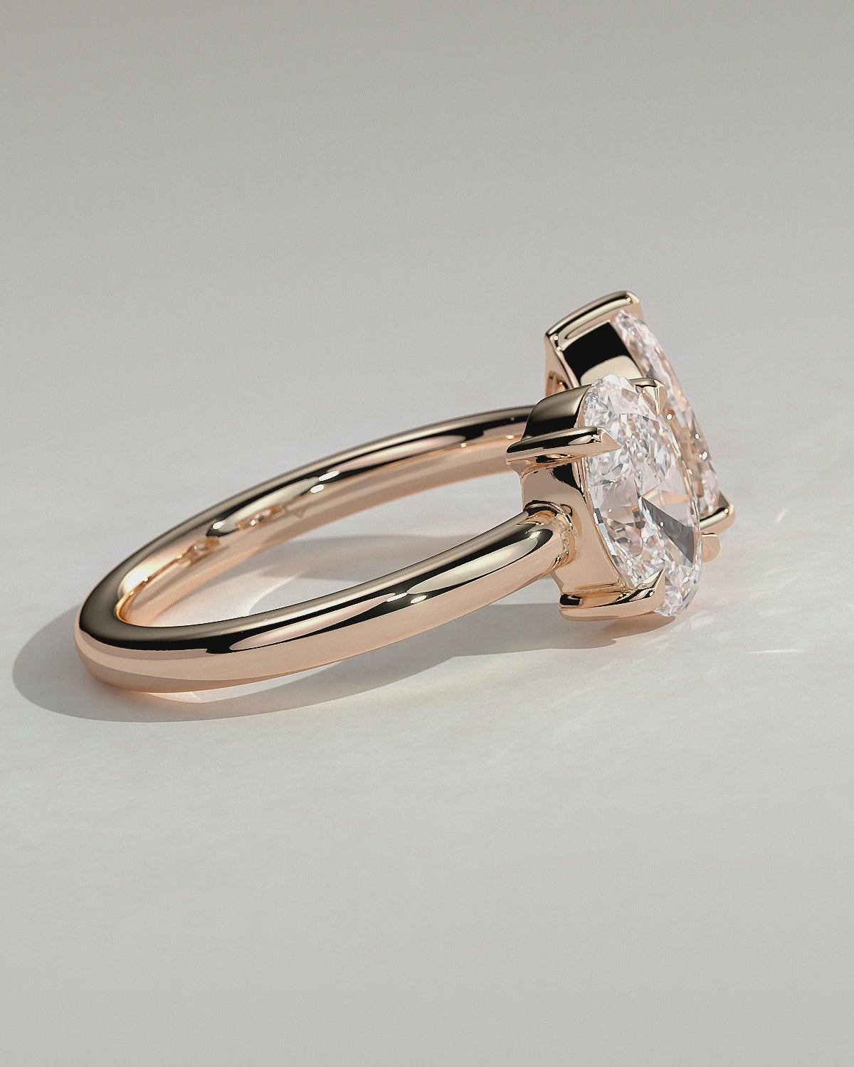 Rose :: Noriquea oval and pear toi et moi lab grown diamond engagement ring 360 view rose gold IGI certified two stone ring