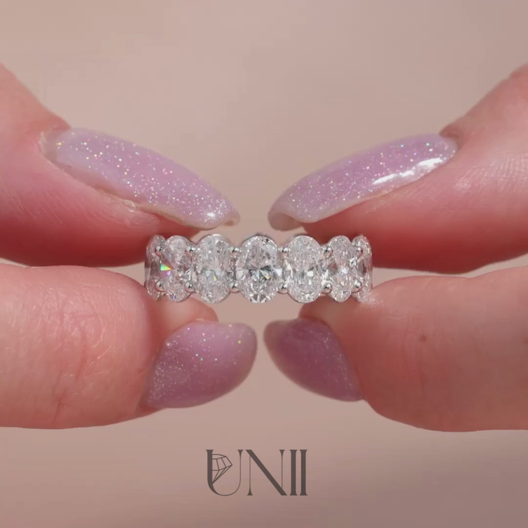 Common :: 7ct oval lab grown diamond eternity ring in white gold featuring IGI certified diamonds. An ultra luxury full diamond band with brilliant sparkle and elongated oval design, created for bold statement styling, stacking, and collector-level occasions.