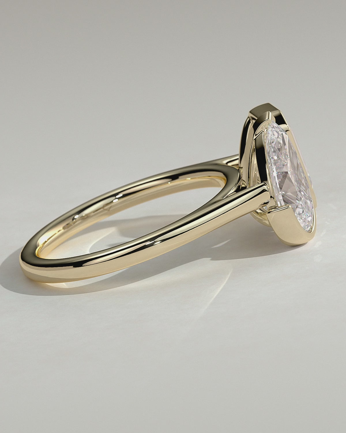 Yellow :: Calvellae 3.3ct pear and 3.3ct emerald bezel toi et moi lab grown diamond engagement ring 360 view yellow gold IGI certified two stone ring