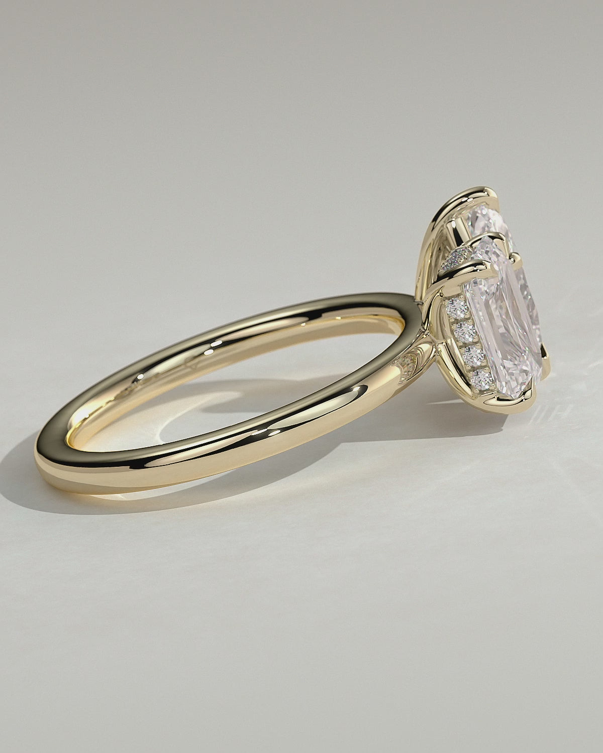 Yellow :: Orinora 1.8ct emerald and 1.5ct pear hidden halo toi et moi lab grown diamond engagement ring 360 view yellow gold IGI certified two stone ring