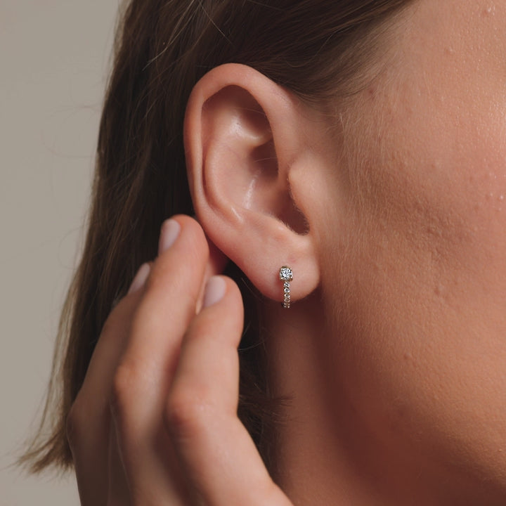 Common :: delicate lab grown diamond huggie hoops white gold minimal circular design subtle everyday luxury earrings