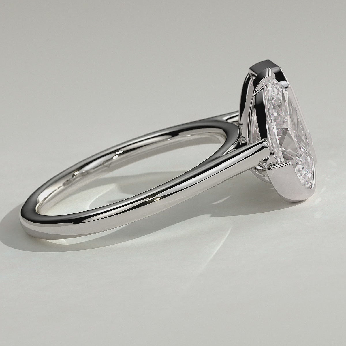 White :: Calvellae 3.3ct pear and 3.3ct emerald bezel toi et moi lab grown diamond engagement ring 360 view white gold IGI certified two stone ring