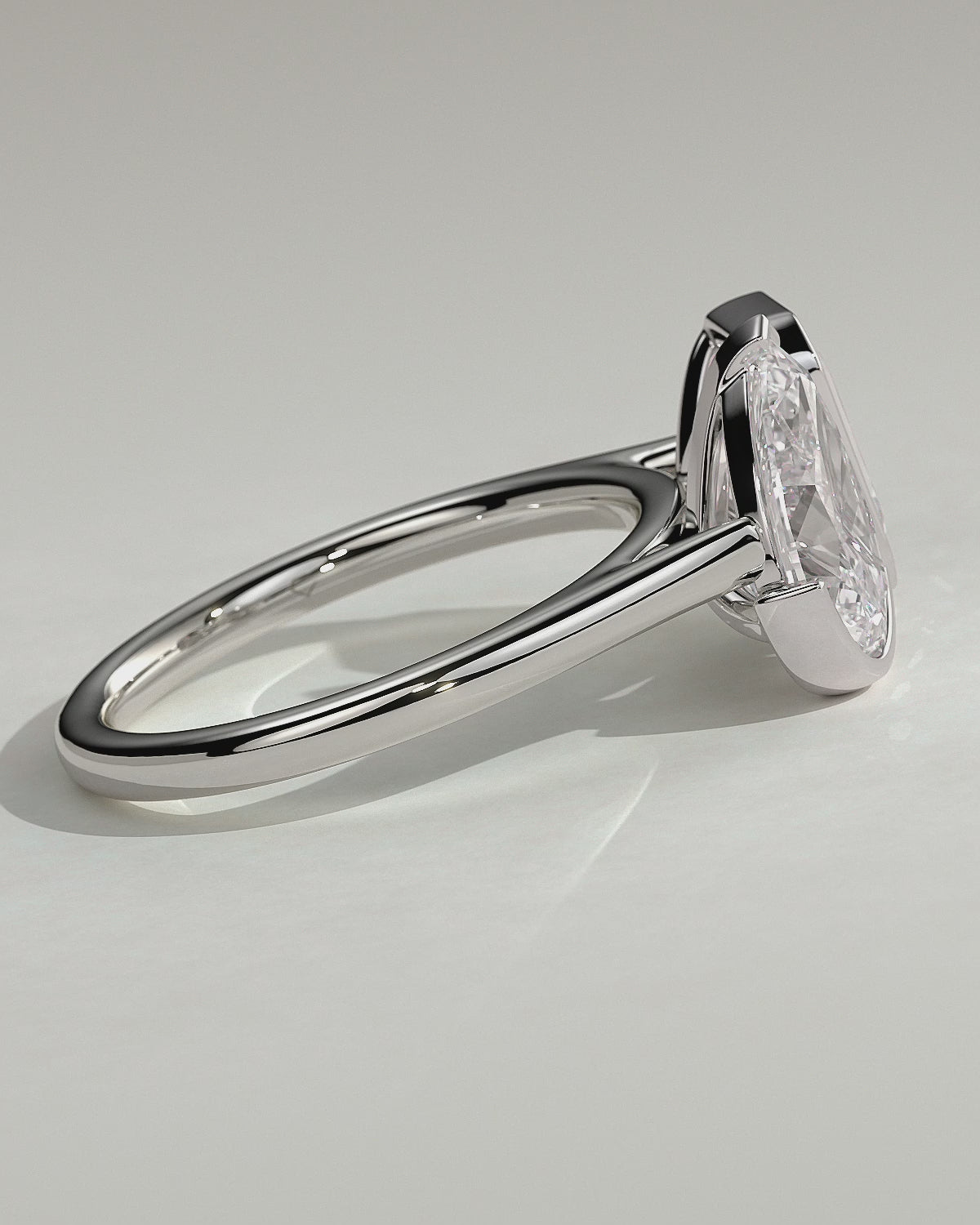 White :: Calvellae 3.3ct pear and 3.3ct emerald bezel toi et moi lab grown diamond engagement ring 360 view white gold IGI certified two stone ring