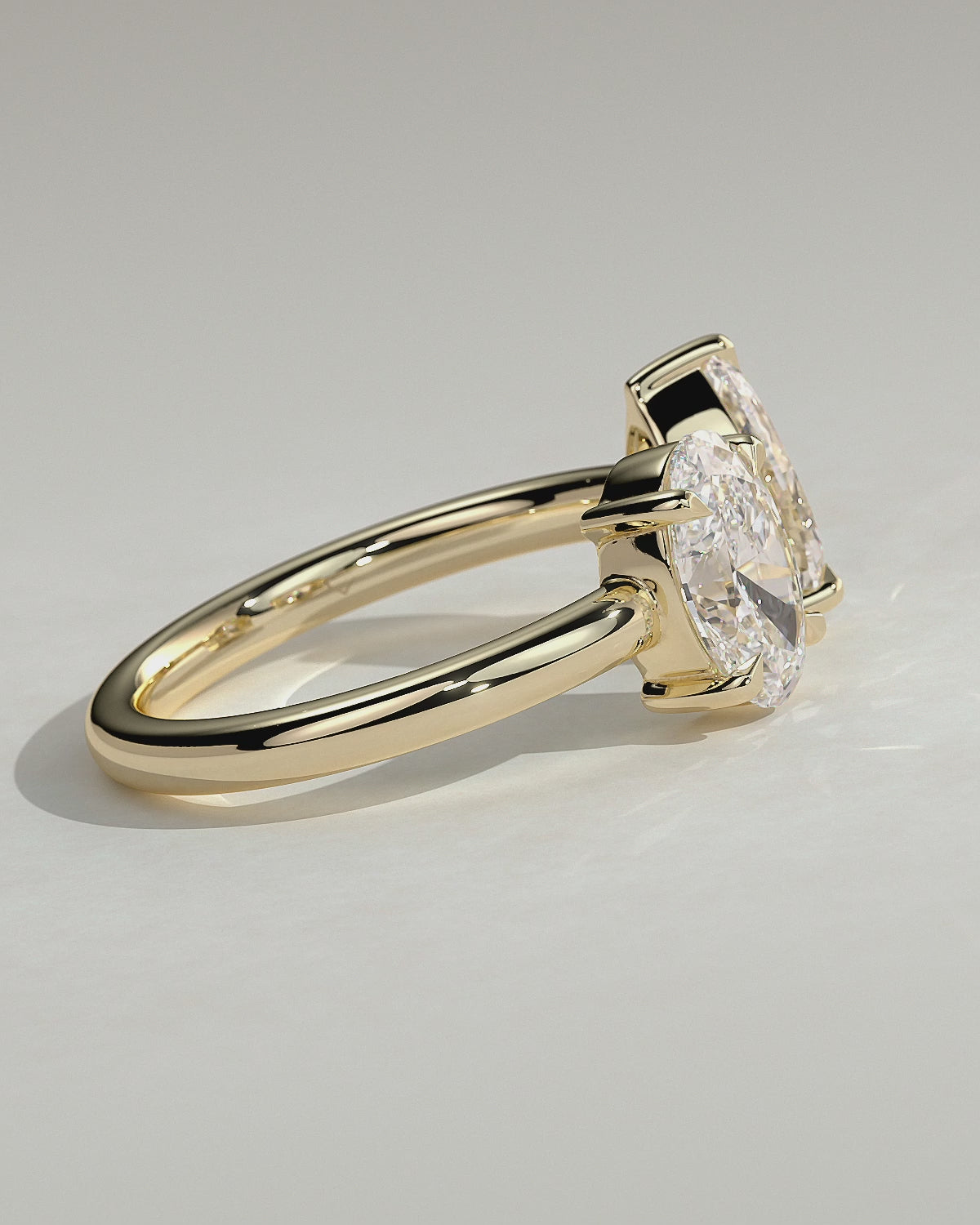 Yellow :: Noriquea oval and pear toi et moi lab grown diamond engagement ring 360 view yellow gold IGI certified two stone ring