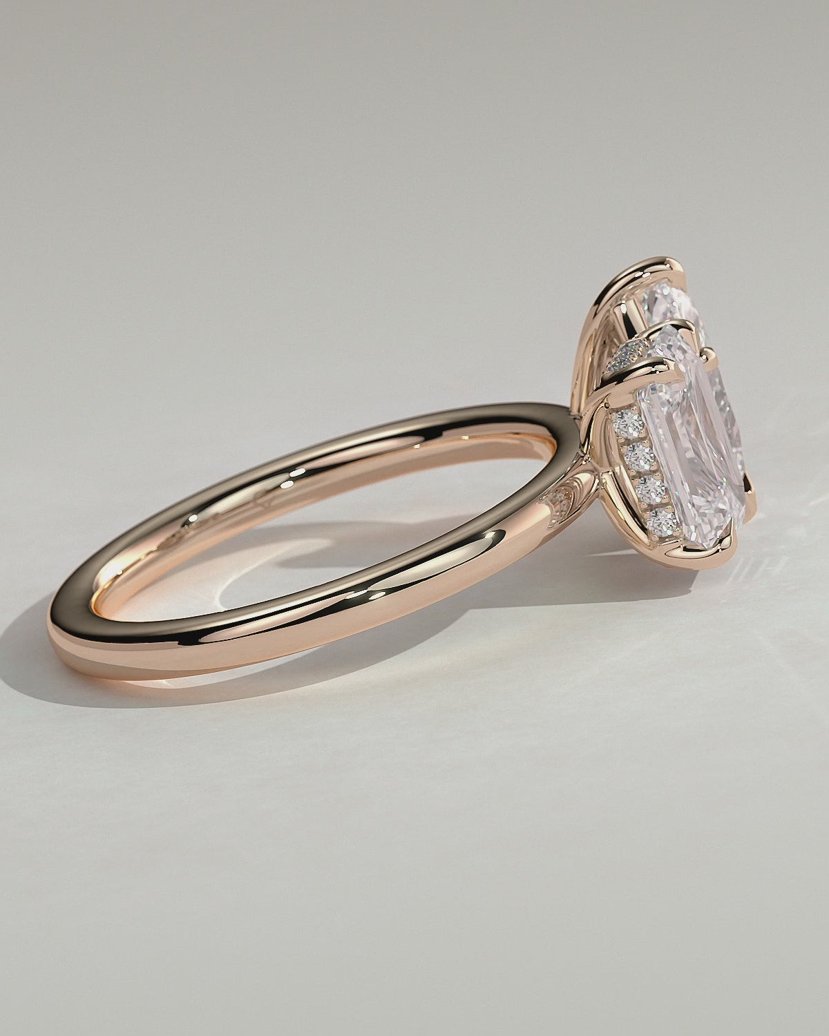 Rose :: Orinora 1.8ct emerald and 1.5ct pear hidden halo toi et moi lab grown diamond engagement ring 360 view rose gold IGI certified two stone ring