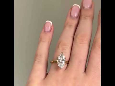 Common :: Video showcase of a 2.10TCW marquise lab grown diamond hidden halo engagement ring.