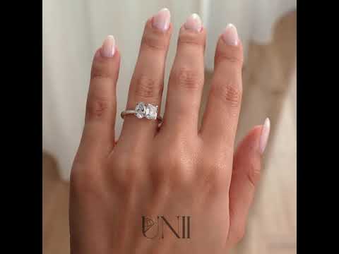 White :: Oval and emerald lab grown diamond toi et moi engagement ring in white gold featuring IGI certified diamonds. A romantic two-stone design symbolizing “you and me,” combining oval brilliance with emerald step-cut elegance for a modern luxury statement.