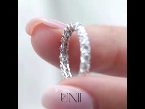 White | Rose :: 2ct round lab grown diamond eternity ring in white gold featuring IGI certified diamonds. Designed with a trellis setting for an elegant woven look, this full diamond band delivers maximum brilliance and modern luxury styling.