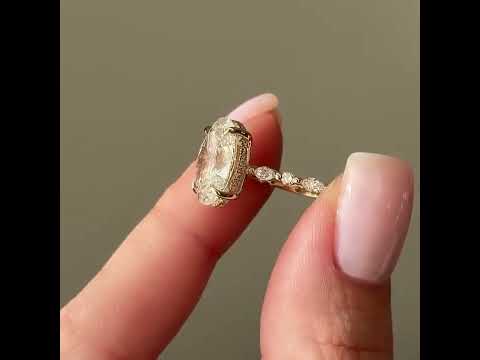 Common :: Video showcase of a 4.90TCW oval lab grown diamond hidden halo engagement ring.