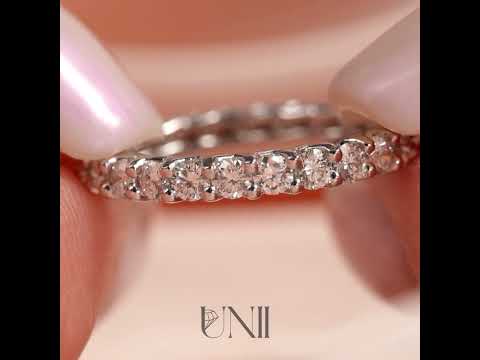Common :: 1.5ct round lab grown diamond eternity ring in white gold featuring IGI certified diamonds. Designed with a trellis setting for an elegant woven look, this full diamond band delivers maximum brilliance and modern luxury for stacking or everyday wear.