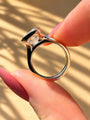 Common :: Close-up of a radiant lab-grown diamond engagement ring with a smooth bezel frame