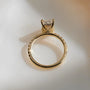 Common :: Radiant-cut hidden halo engagement ring featuring a delicate 2MM band.