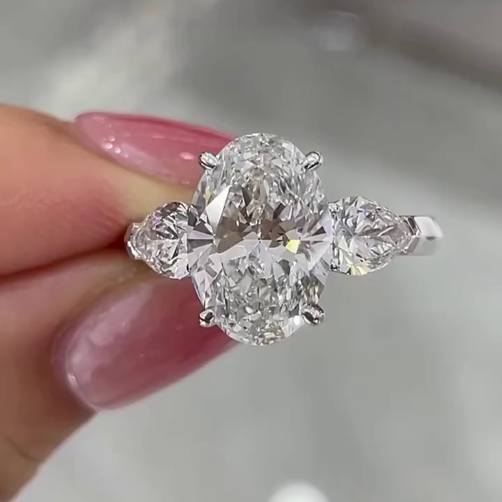 Oval 5.00tcw Lab Grown Diamond 3 Stone Engagement Ring | D-E-F Color VVS-VS Clarity | Pear Side Stones | IGI Certified