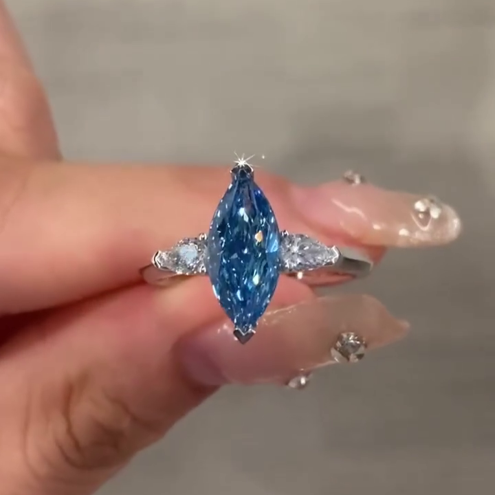 Fancy Blue 1.50tcw Marquise Lab Grown Diamond Three Stone Engagement Ring | IGI Certified | White Gold